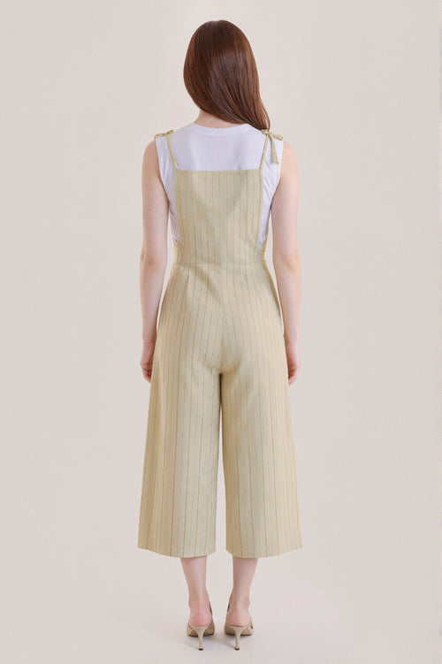 Sleeveless beige jumpsuit with subtle vertical stripes